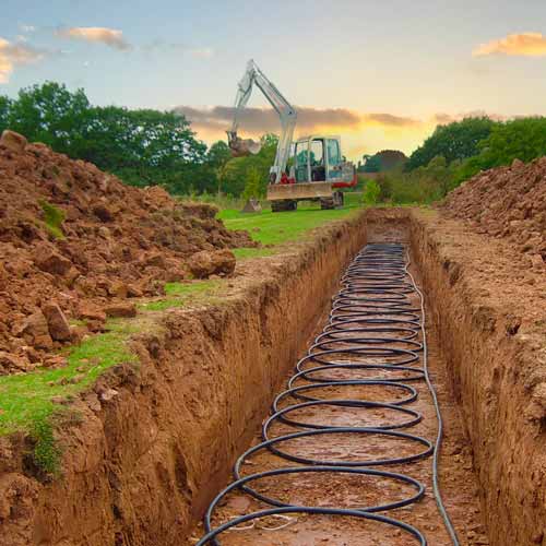 Ground source heat pump collector loop laid in a trench