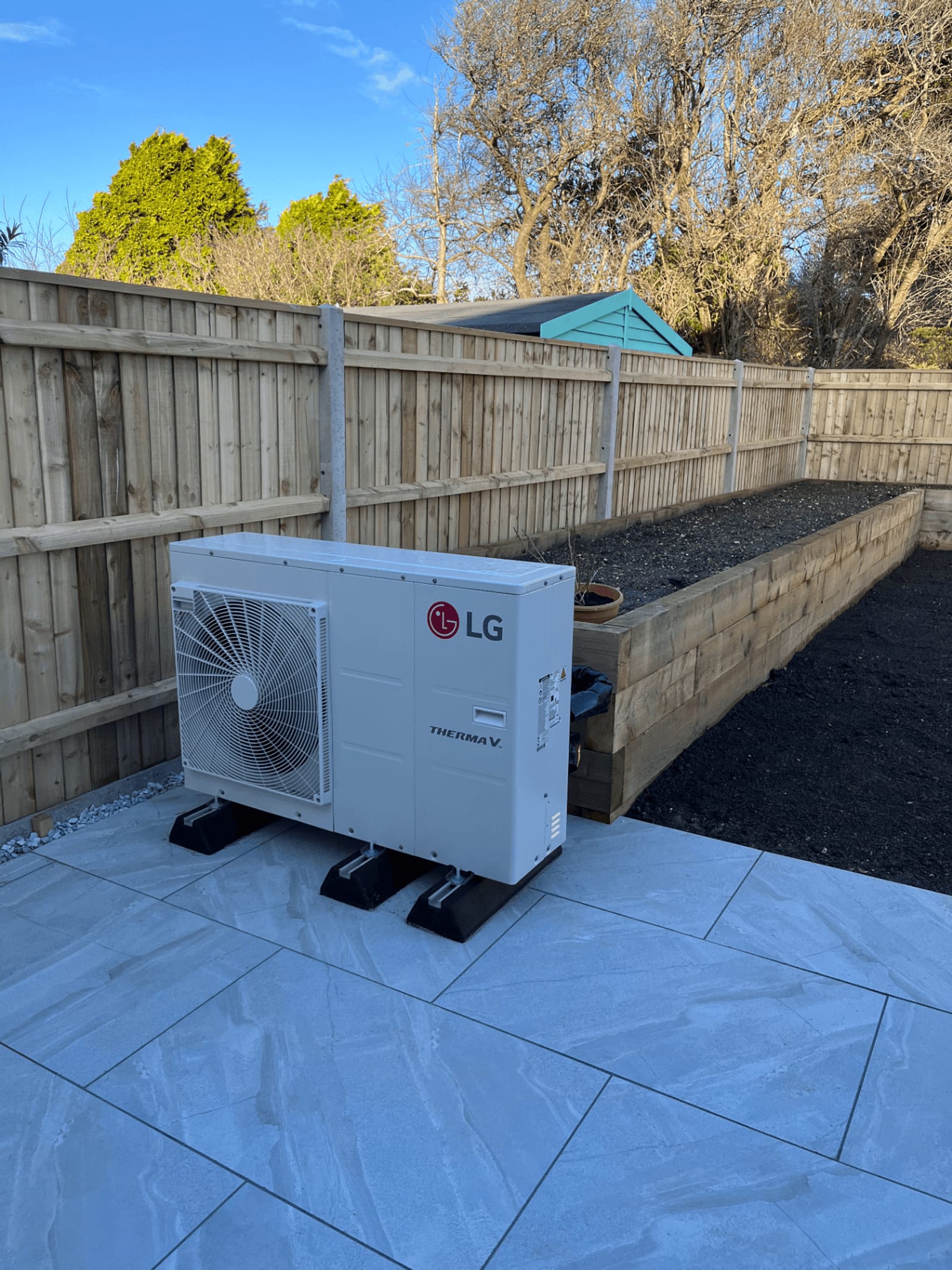 LG Therma V air source heat pump installed in a garden